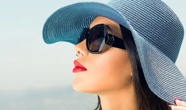 Woman-with-a-luxury- blue-hat-black-sunglasses