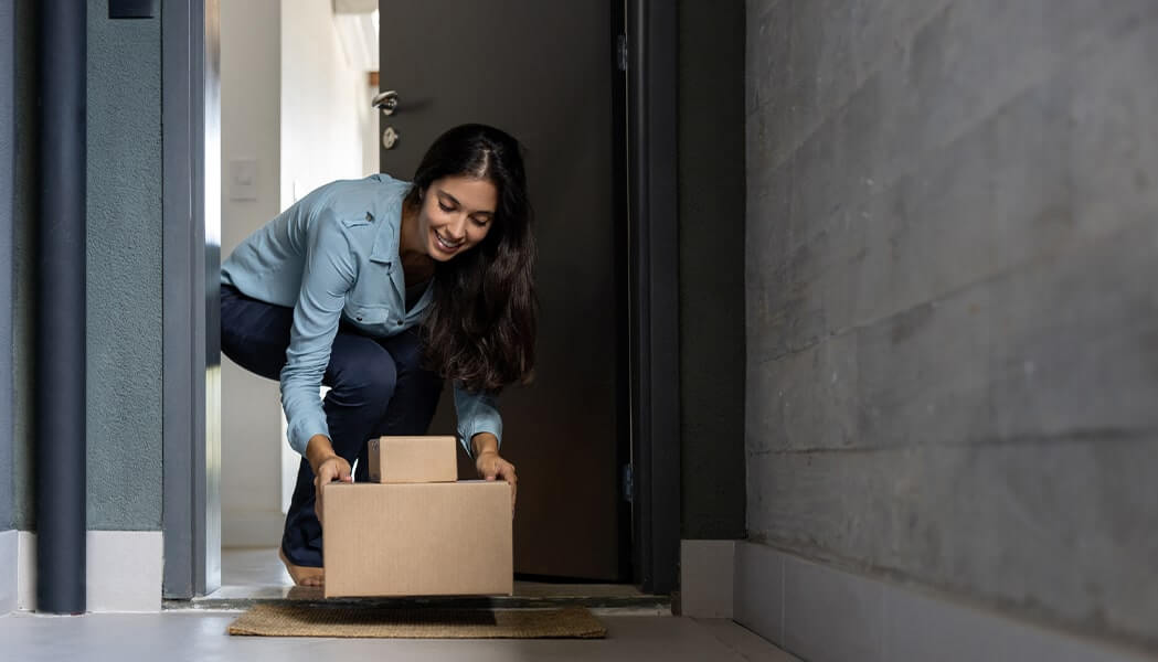 happy woman at home receiving some packages