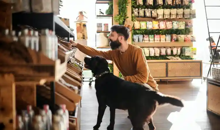 Man and his dog in a pet supply store